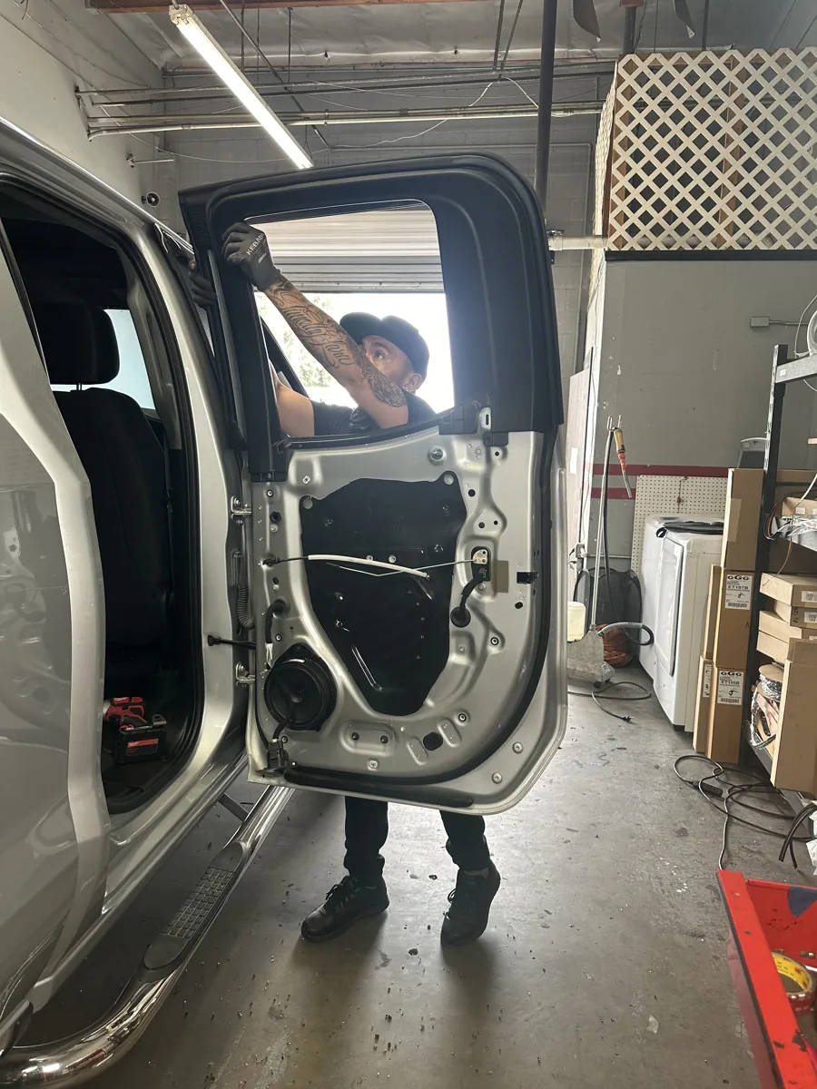 Door glass work inside the Superior shop