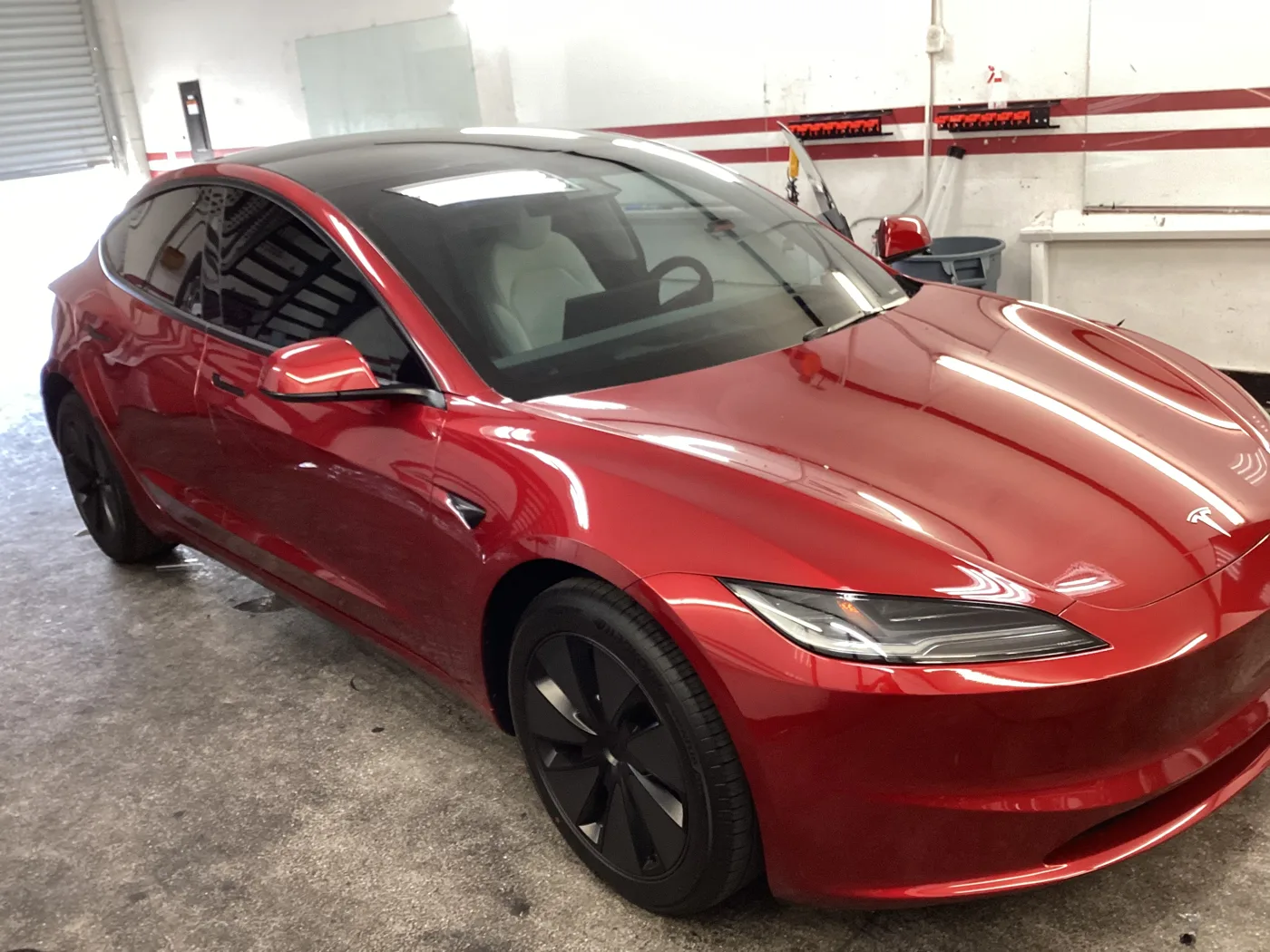 White Tesla with tinted windows outside Superior’s Ontario shop